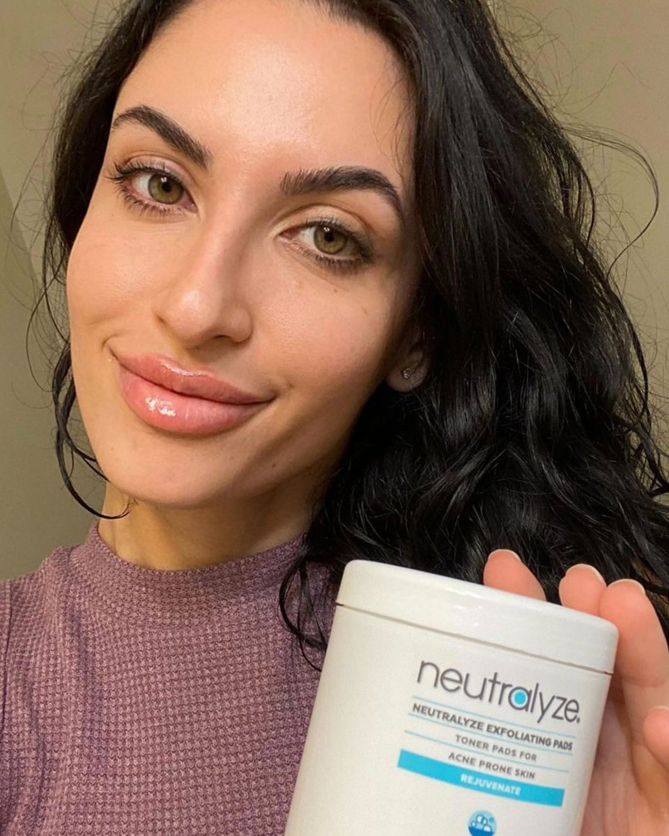 Neutralyze customer holding her product